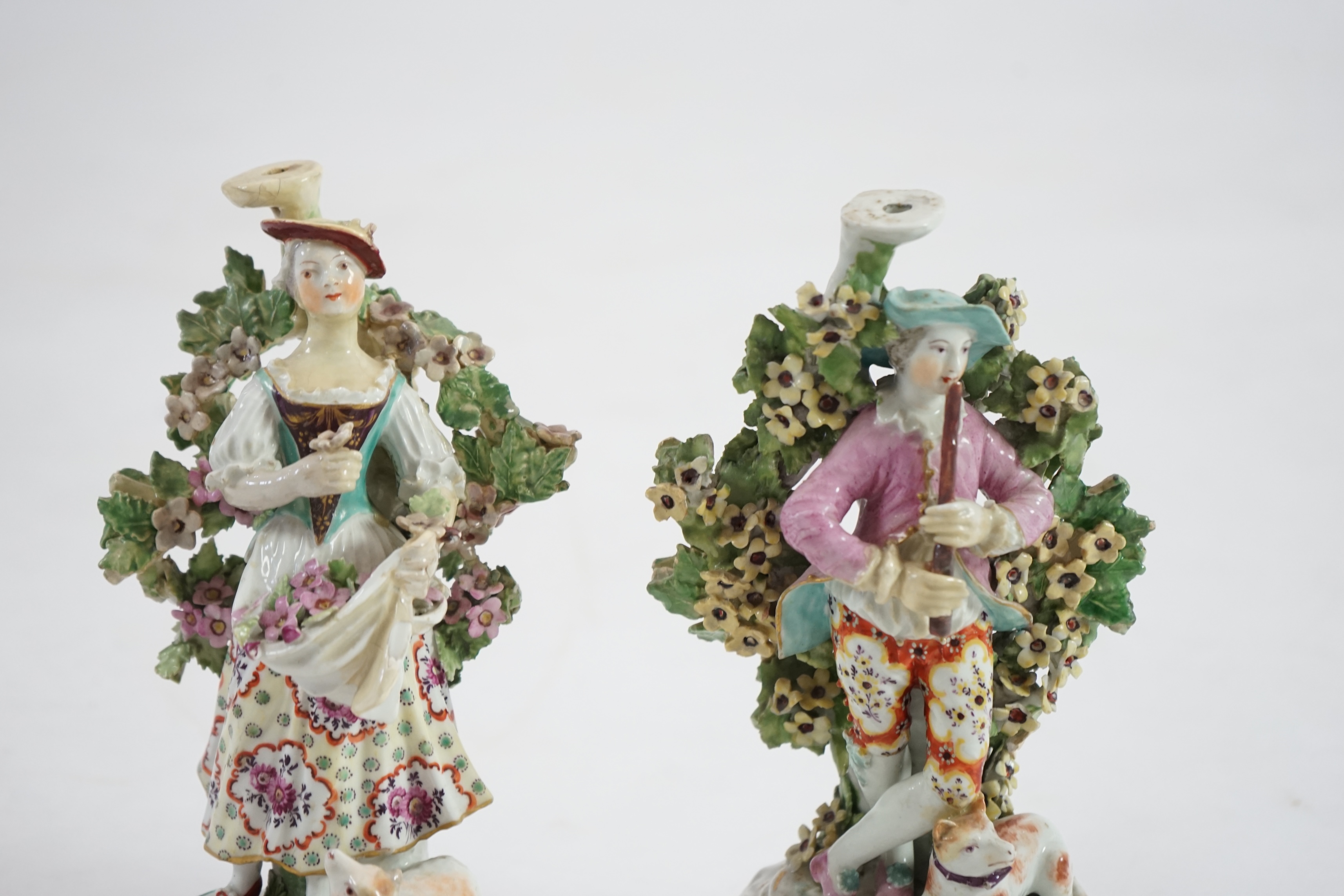 A pair of Derby candlestick groups of a shepherd and shepherdess, c.1775